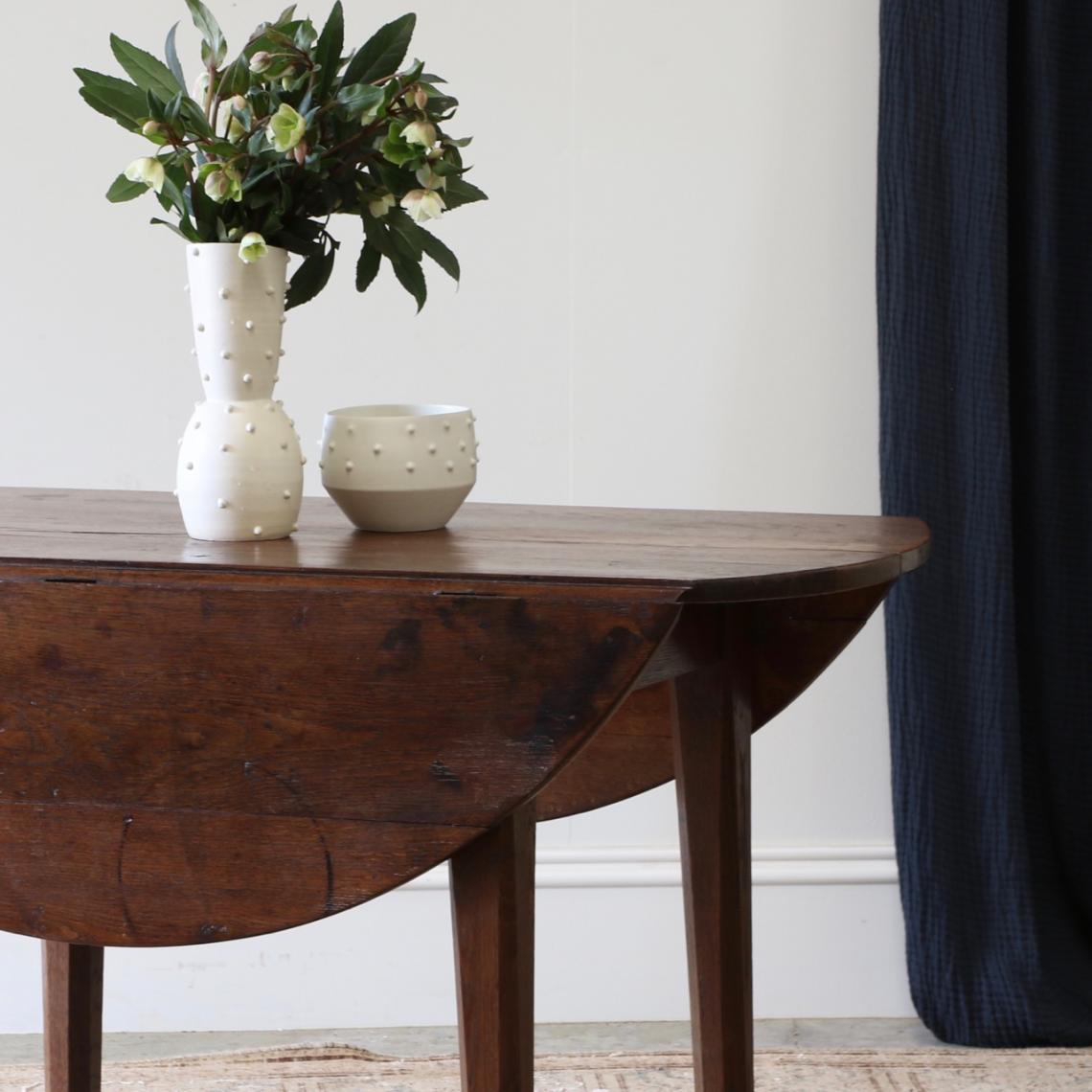 A Round Drop Side Dining Table